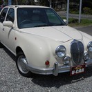  光岡自動車 ビュート 1.0 デラックス　 （ベージュ） セダンの画像