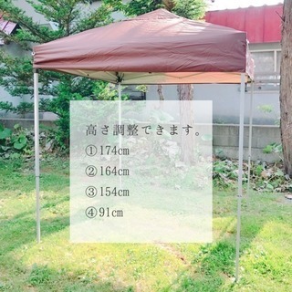 茶色いタープテントの画像