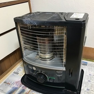 石油ストーブと柵