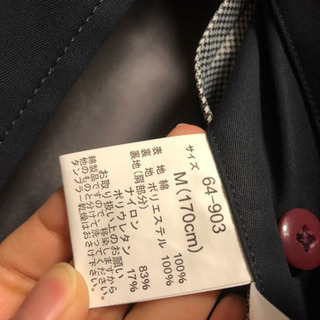 新品タグ付きメンズコートの画像