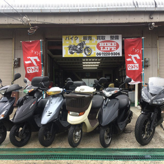 バイク屋でのチラシ配布スタッフ