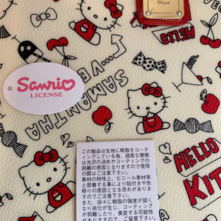 ハローキティとサマンサベガコラボのショルダーバッグ新品未使用定価11500円ショルダーを外せばポーチとして使用できます縦18cm横28cmですこのバックは樹脂コーティングしてあります写真が全てです取引き場所は御宿駅までお願いしますの画像