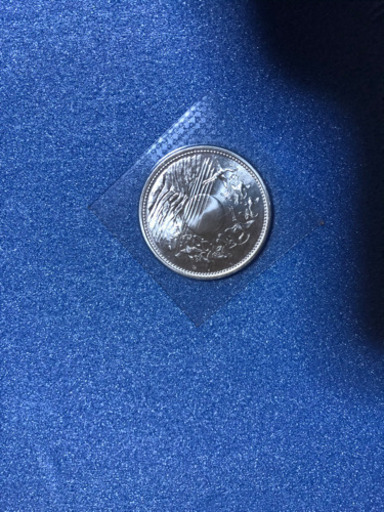 天皇陛下御在位六十年記念一万円銀貨