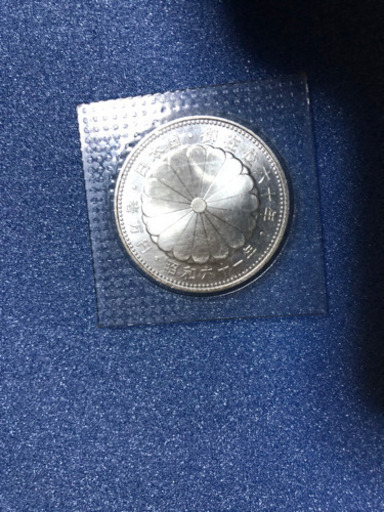 天皇陛下御在位六十年記念一万円銀貨