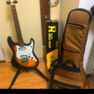 ビザールギター、セミハードケース、スタンドの画像