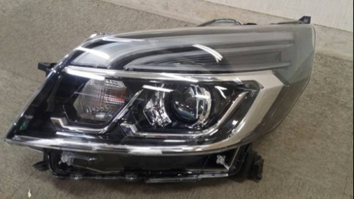 ミツビシ　EKスペースカスタム 左ヘッドライト