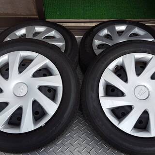 軽自動車用 14ｲﾝﾁｽﾁｰﾙﾎｲｰﾙｾｯﾄ ﾎｲｰﾙｷｬｯﾌﾟ付き中古4本の画像