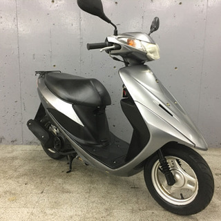 バイク屋でのチラシ配布スタッフ