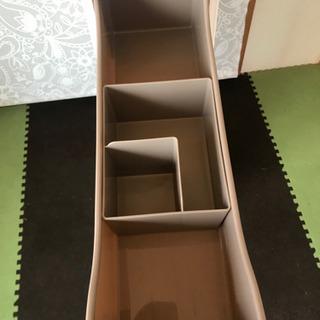 トイレのデッドスペースにペーパー収納の画像