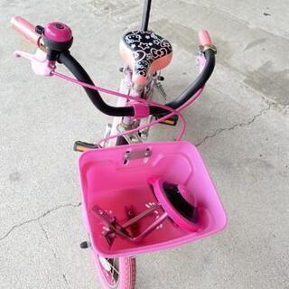 ハローキティー　14インチ自転車
補助輪付き・アシストバー付きの画像