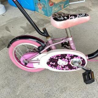 ハローキティー　14インチ自転車
補助輪付き・アシストバー付きの画像