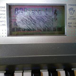 CASIOキーボード（楽譜スタンド付）の画像