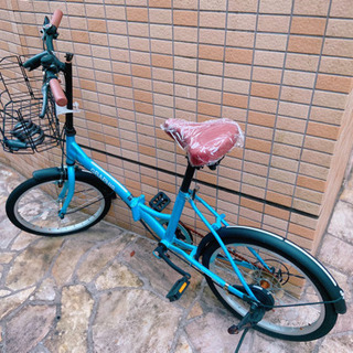 折り畳み自転車(タイヤは空気漏れかパンクしています)の画像
