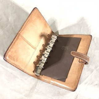 COACH コーチ キャメルブラウン レザー×キャンバスシグネチャー アジェンダPM 手帳カバー6穴の画像