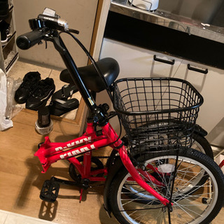 赤色の折りたたみ中古自転車の画像