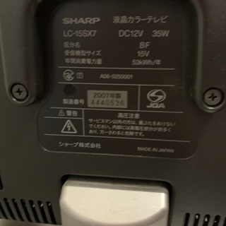 テレビ、リモコン、テレビ台の画像