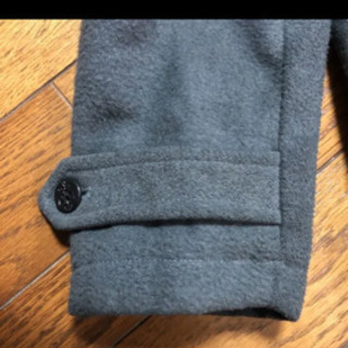 グレーのコートの画像