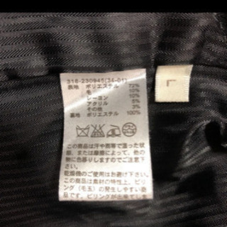 グレーチェックのコートの画像