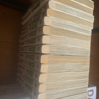 よつばと！のコミックと、ダンボーのフィギュアの画像