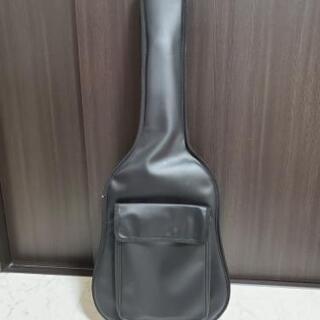 アコースティックギター ケース、カポ付きの画像