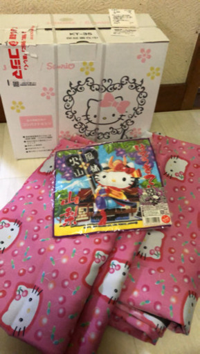 ミシン(未開封)とカーテン