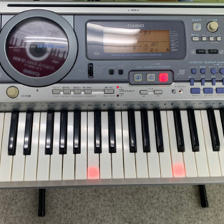 値下げしました　CASIO 光ナビゲーション 電子ピアノ スタンド付きの画像