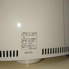 電気ストーブ商談中の画像