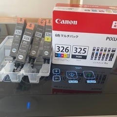 canonプリンターと新品インクカートリッジの画像