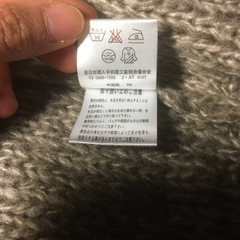 ニットベスト　編み込み　茶　の画像