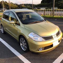 日産ティーダ１５M　ハーベストイエロー　最終値下げ。車検２年付　車検無でよろしければ価格別途お出しいたします。禁煙車  初期型しか設定が無い発売時のイメージカラー（CM使用色）です。２月１８日迄の掲載といたします。の画像
