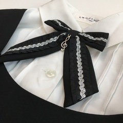 140 コサージュ付き黒色ワンピースセットの画像