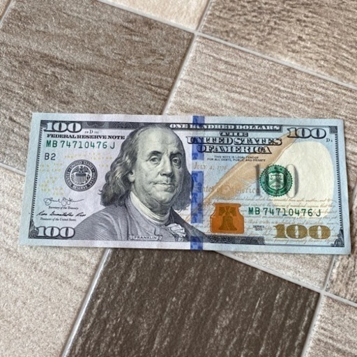 新札100ドル
