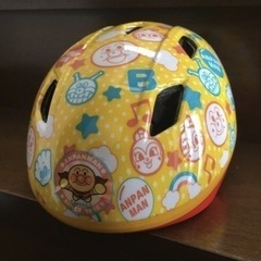 幼児用自転車（ピンク）とアンパンマンヘルメットの画像