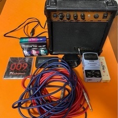 エレキギターと付属品一式の画像