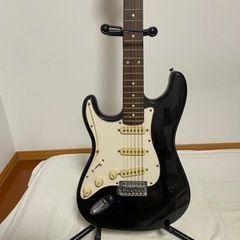 エレキギターと付属品一式の画像