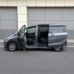 フリードＧエアロ　ジャストセレクション　Ｈ22　車検5/3　走行94000ｋ　純正メモリーナビ＆地デジＴＶ＆フリップダウンモニター　カラーバックカメラ　ETC　両側パワースライド　純正エアロ＆15ＡＷ　キセノン　3列シート7人乗り　の画像