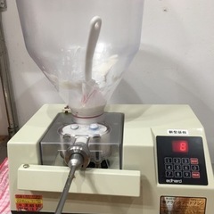 自動クリーム装填機