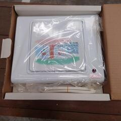 電気ウォマーと鍋の画像