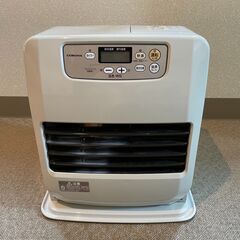 ストーブと灯油ポットと灯油をすくう機械