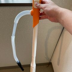 ストーブと灯油ポットと灯油をすくう機械の画像