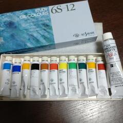 油絵具と筆洗器の画像