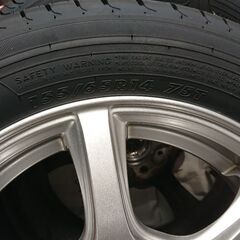 155 65R/14サイズの新品未使用タイヤと中古アルミホイールのセットの画像