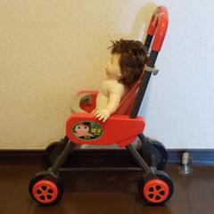 ぽぽちゃん人形とベビーカーの画像