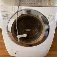 縦型のドラム式洗濯機、乾燥付きの画像