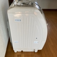 縦型のドラム式洗濯機、乾燥付きの画像