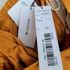 メルロー タグ付き オレンジ ロングスカートの画像