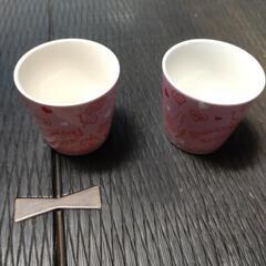 小さなピンクのコップの画像