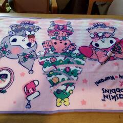 リボンリュックとマイメロブランケットの画像