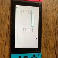 Nintendo Switch本体とProコントローラー2個の画像