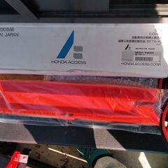 三角停止表示板とブースターケーブルの写真の画像